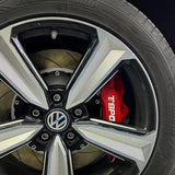 A red TTSPORT 5430 4-piston big brake kit is installed on the 18" front wheel.