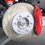 A red TTSPORT 7640 6-piston big brake kit with slotted rotor.