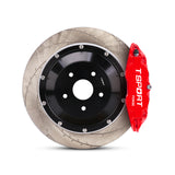 Close-up of a red TTSPORT 8611S 6-piston forged brake caliper for the front wheel and a slotted 2-piece floating rotor.