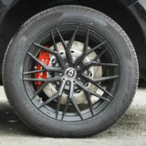 A red TTSPORT 8611S 6-piston big brake kit is installed on the 17" front wheel.