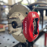 A red TTSPORT DRT4 4-piston drift brake kit is installed on the front wheel.