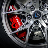 A red TTSPORT EB4 4-piston big brake kit is installed on the 18" front wheel.