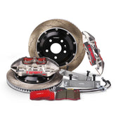 Complete TTSPORT EMB4 rear wheel big brake kit, showing the 4-piston monoblock calipers, slotted 2-piece floating rotor, performance pads, and steel-braided brake lines.