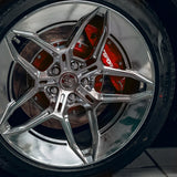 A red TTSPORT EP4S 4-piston big brake kit is installed on the 19" rear wheel.