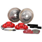 Complete TTSPORT EP4S rear wheel big brake kit, showing the 4-piston forged calipers with EPB motor, slotted 2-piece floating rotor, performance pads, and steel-braided brake lines.