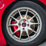 A red TTSPORT 4-piston big brake kit is installed on the Honda Fit/Jazz front wheel.