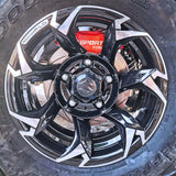 A red TTSPORT 4-piston big brake kit is installed on the SUZUKI jimny front wheel.