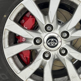 A red TTSPORT Toyota Land Cruiser and Prado 6-piston big brake kit is installed on the front wheel.