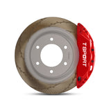 Close-up of a red TTSPORT PB6 for Ford Bronco U752 6-piston forged brake caliper for the front wheel and a slotted rotor.