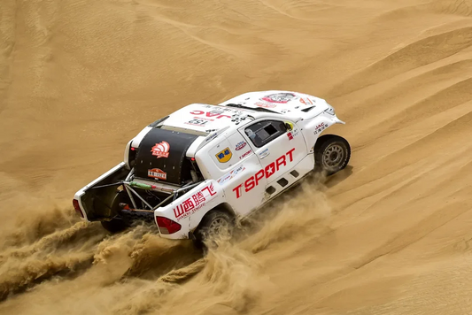 TTSPORT rally truck kicking up dust during the 2025 China Taklimakan Rally desert stage
