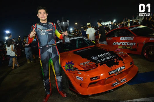 Drift car sliding through a corner at D1GP Thailand with TTSPORT brake calipers visible