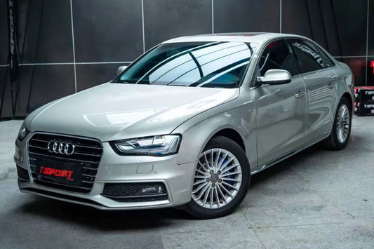 Audi A4 sedan fitted with the TTSPORT Slim SL6 big brake kit tucked behind its stock 17-inch wheels