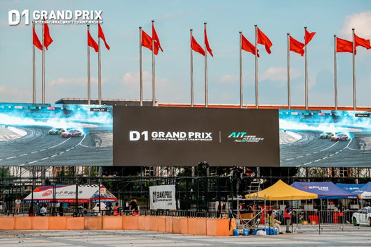 Drift car sliding through tire smoke at the 2025 D1 Grand Prix China finale in Dongguan