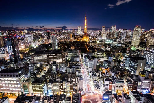 TTSPORT mascot figure posed against the Tokyo skyline ahead of Tokyo Auto Salon
