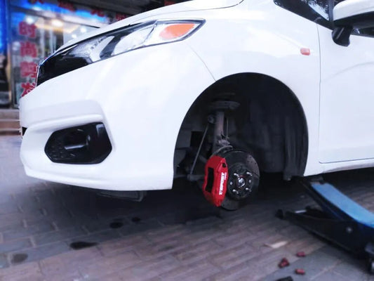 Honda Fit/Jazz GK5 with TTSPORT Slim Series four-piston front brake kit fitted behind a 15-inch OEM wheel