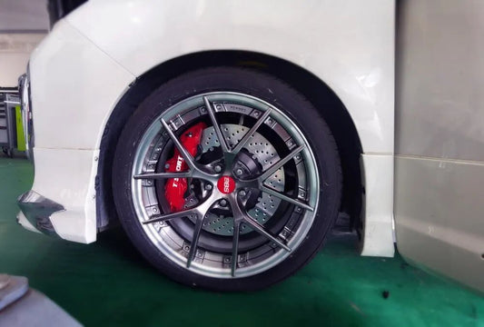 Toyota Alphard fitted with a red TTSPORT front six-piston caliper and 380mm rotor behind the 19-inch wheel