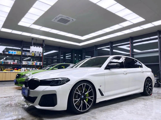 BMW 5 Series fitted with TTSPORT front six-piston big brake caliper and 405mm drilled rotor behind 20-inch wheel