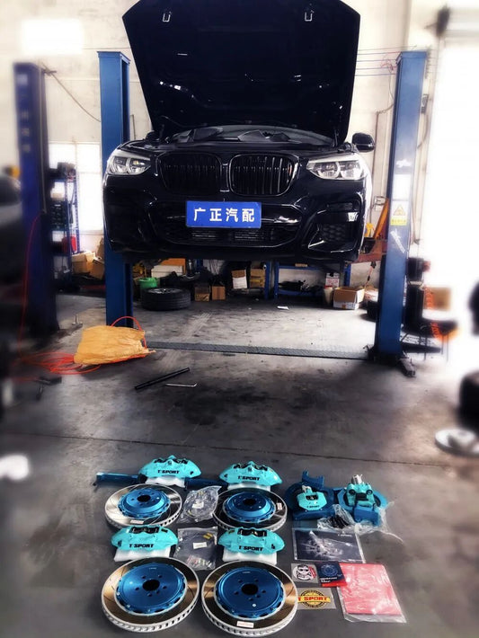 BMW X4 with custom Tiffany blue TTSPORT 8657 six-piston front big brake kit installed behind the factory wheel