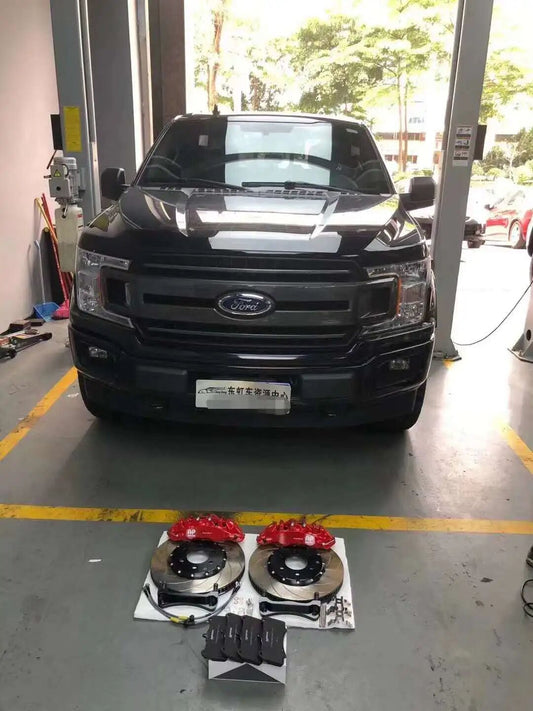 Ford F-150 Raptor with TTSPORT 9560 six-piston big brake kit installed behind factory 20-inch wheels
