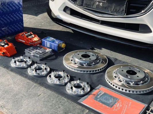Mazda 3 Axela fitted with a red TTSPORT 5200 forged four-piston caliper behind an 18-inch wheel