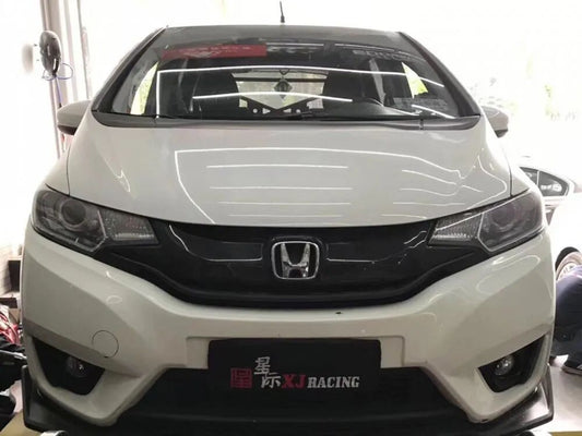 Honda Fit/Jazz GK5 fitted with a gray TTSPORT 5040 big brake kit caliper behind its stock 15-inch wheel