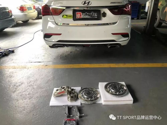 Hyundai Mistra sedan fitted with TTSPORT Classic 5440 forged front brake caliper behind a 17-inch wheel