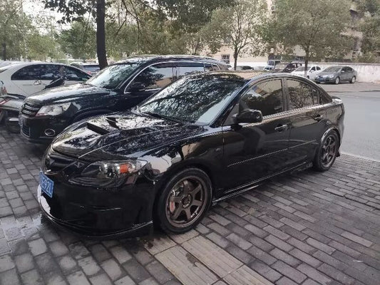 Mazda 3 fitted with TTSPORT Classic 5440 four-piston caliper and dacromet curved-slot rotor behind a 17-inch wheel