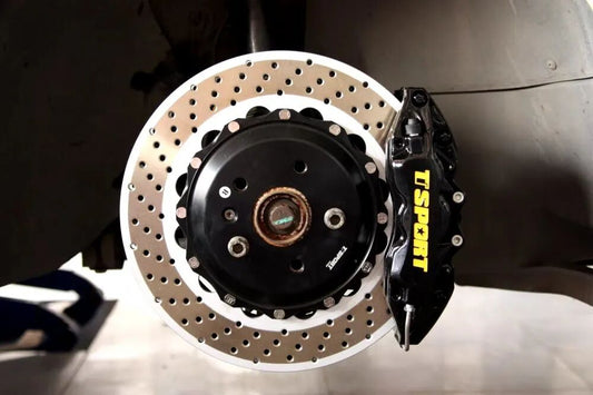 Volkswagen Golf GTI fitted with a TTSPORT 9040 six-piston big brake kit behind stock 18-inch wheels