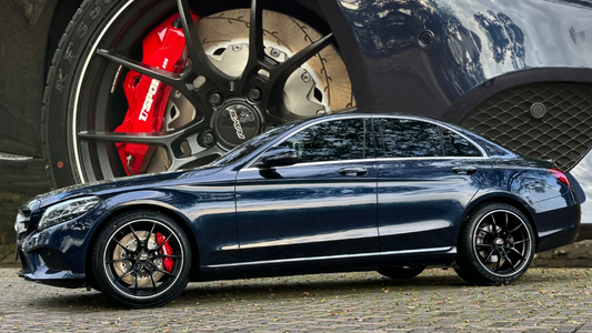 Mercedes-Benz C200 fitted with a red TTSPORT Evolution Series ES6 big brake kit behind the factory 19-inch wheel