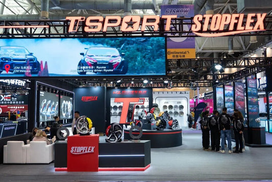TTSPORT booth at Suzhou GT Show featuring a full caliper lineup and international showcase models