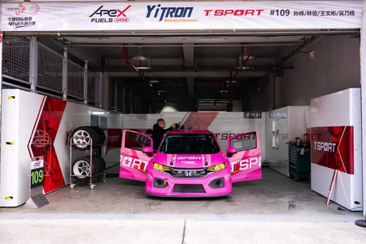 Honda Fit touring car braking hard into a corner at Ningbo International Speedway during a 4-hour endurance race