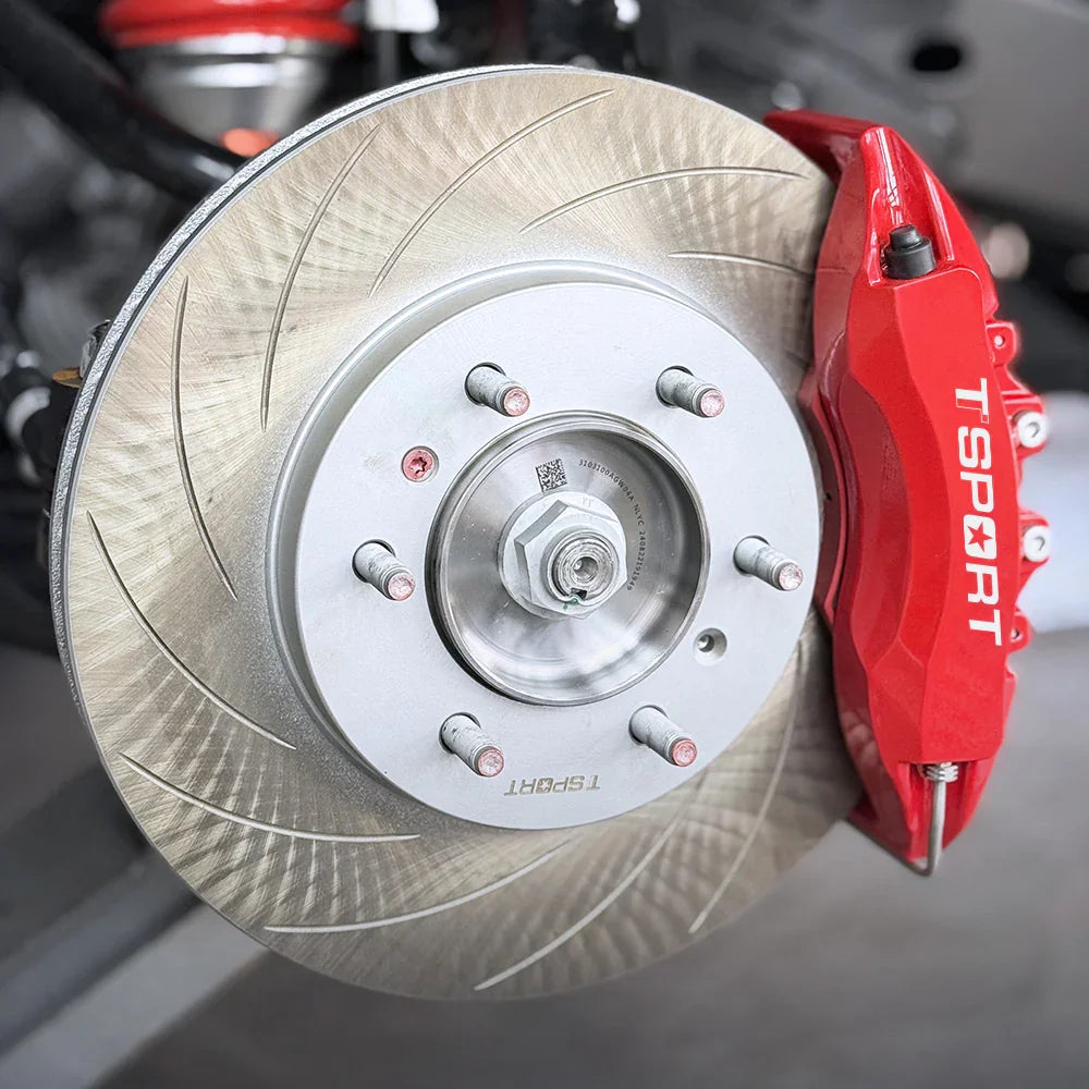 A red TTSPORT 7640 6-piston big brake kit with slotted rotor.