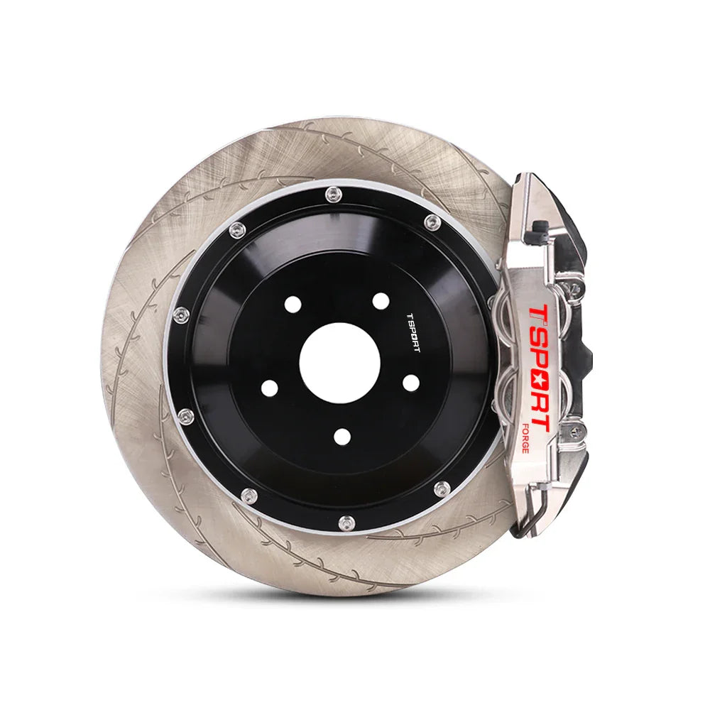 Close-up of a chrome TTSPORT EMB4 4-piston monoblock brake caliper for the rear wheel and a slotted 2-piece floating rotor.