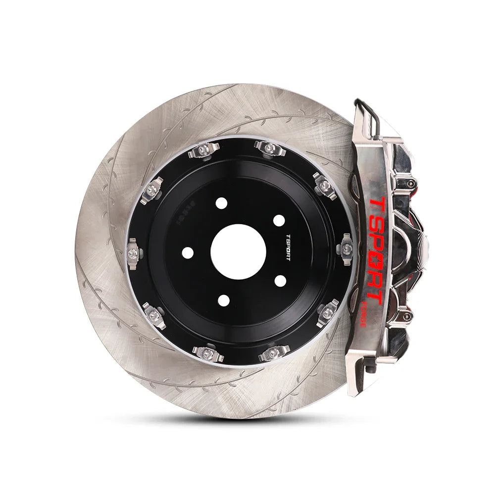 Close-up of a chrome TTSPORT EMB6 6-piston monoblock brake caliper for the front wheel and a slotted 2-piece floating rotor.