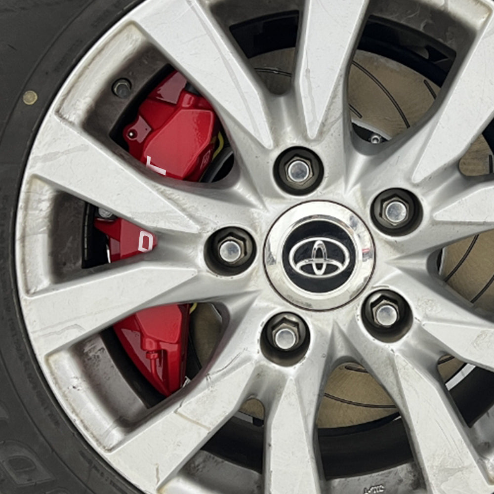 A red TTSPORT Toyota Tundra & Sequoia 6-piston big brake kit is installed on the front wheel.
